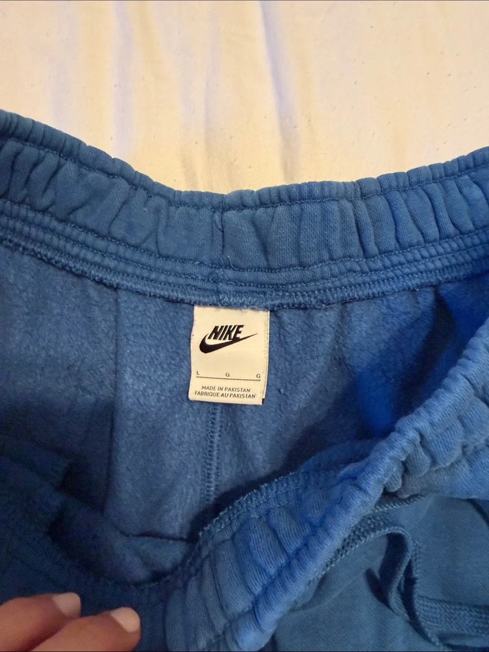 Nike Blue Athletic Shorts with Red and Yellow Logos